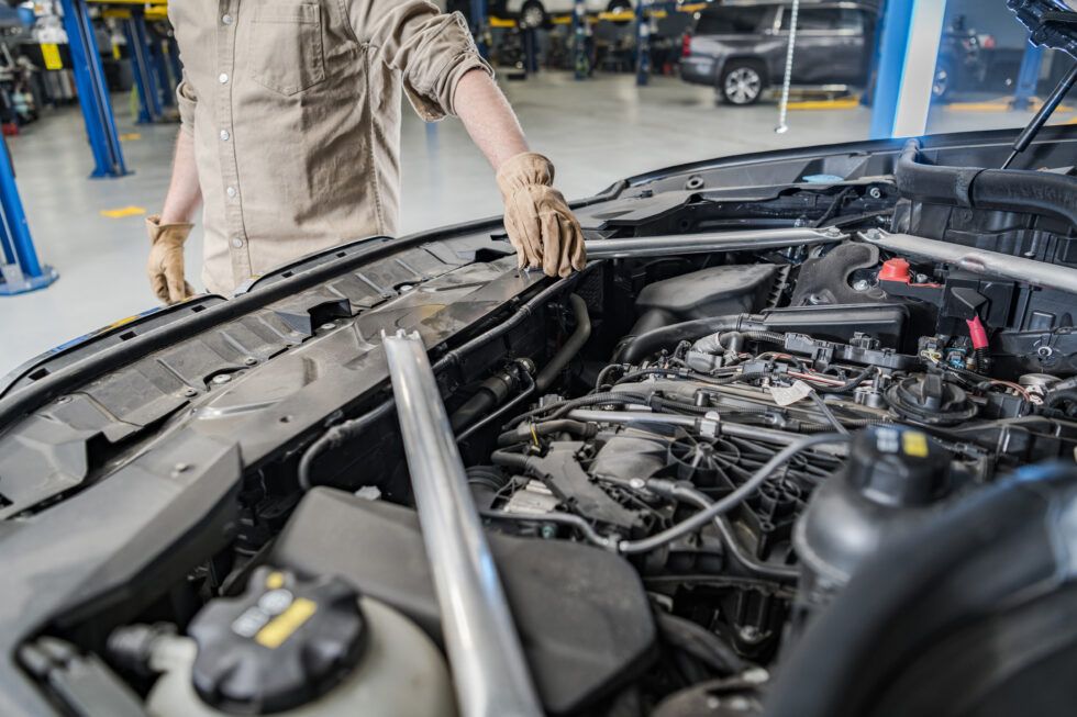 Mechanic inspecting an engine bay