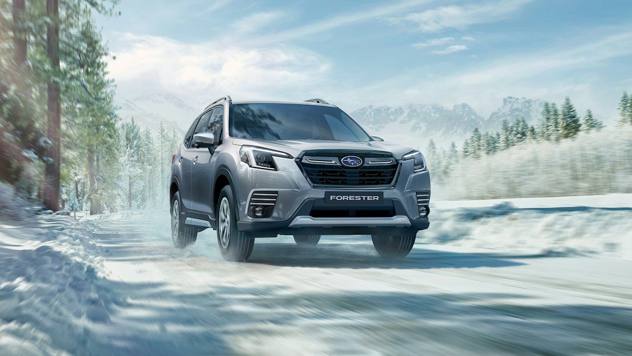 Silver Subaru Forester on a snowy road