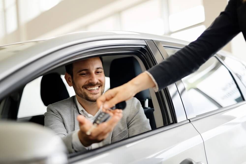 Vehicle keys exchanged during a car purchase