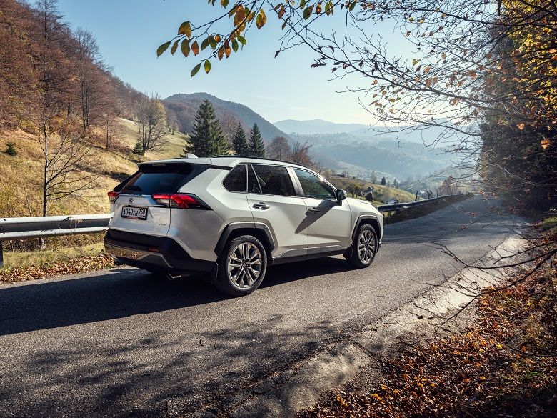 White Toyota RAV4 on a mountain road